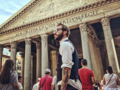 Man in Blue Waistcoat and White Dress Shirt Standing Near Pantheon